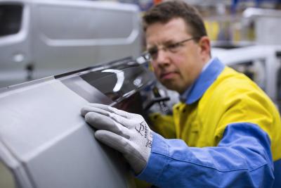 Tata Steel operative inspecting an outer panel