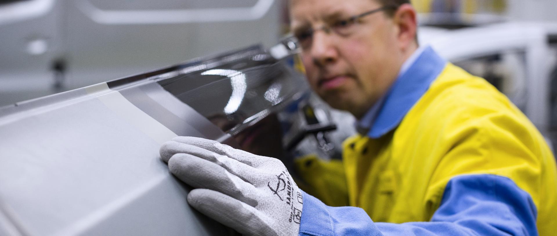 Tata Steel operative inspecting an outer panel