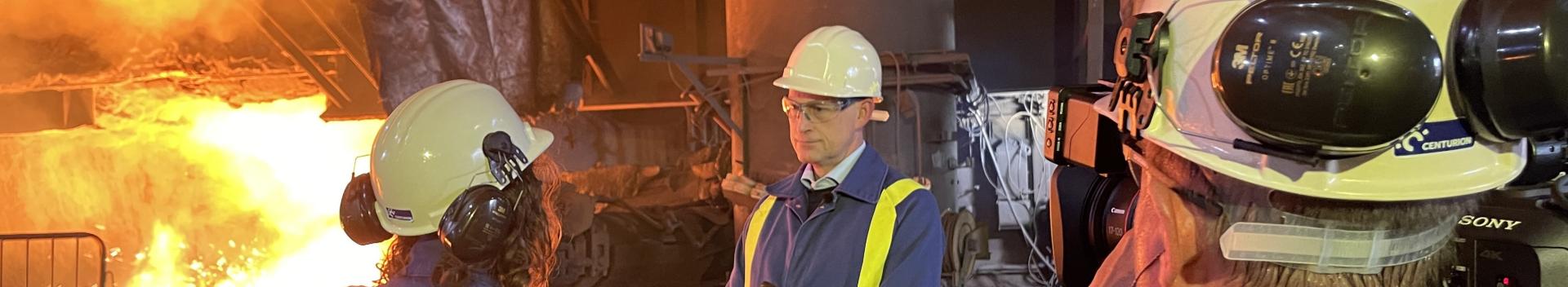 Pete Quinn talks to Elena Casa from Reuters on the Blast Furnace casthouse floor